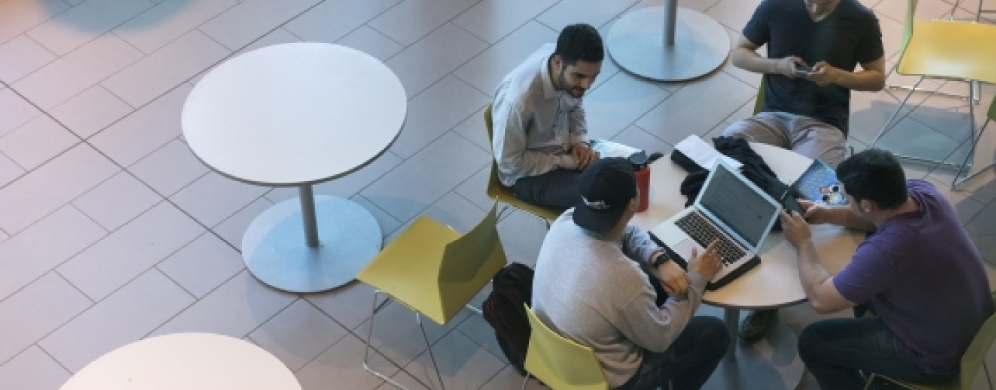 four students at a table