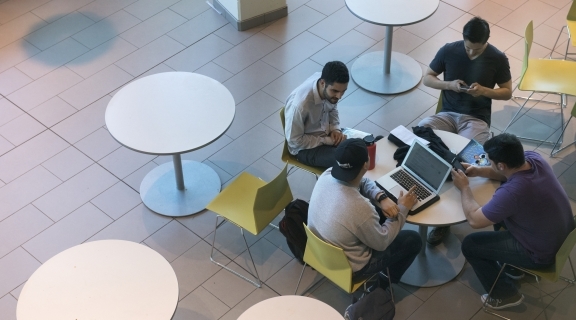 four students at a table